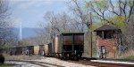 CSX 304819 brings up the rear of the train of empties heading west.